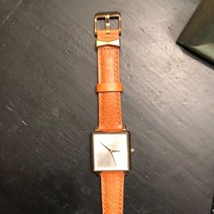 Nixon tan leather and gold watch
